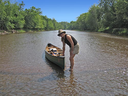 Debra walks a canoe